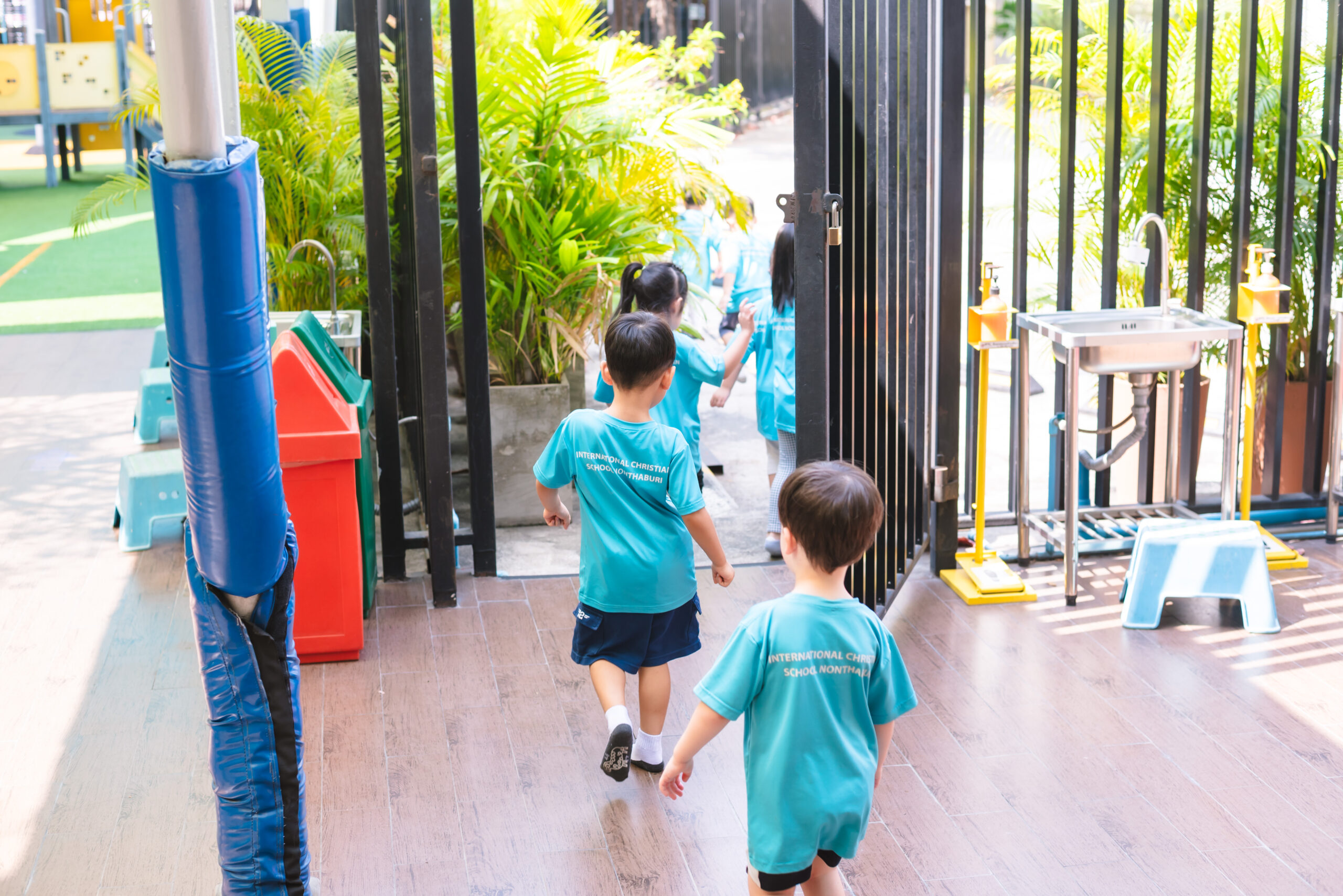 kindergarten students filing out of their classroom in an earthquake drill