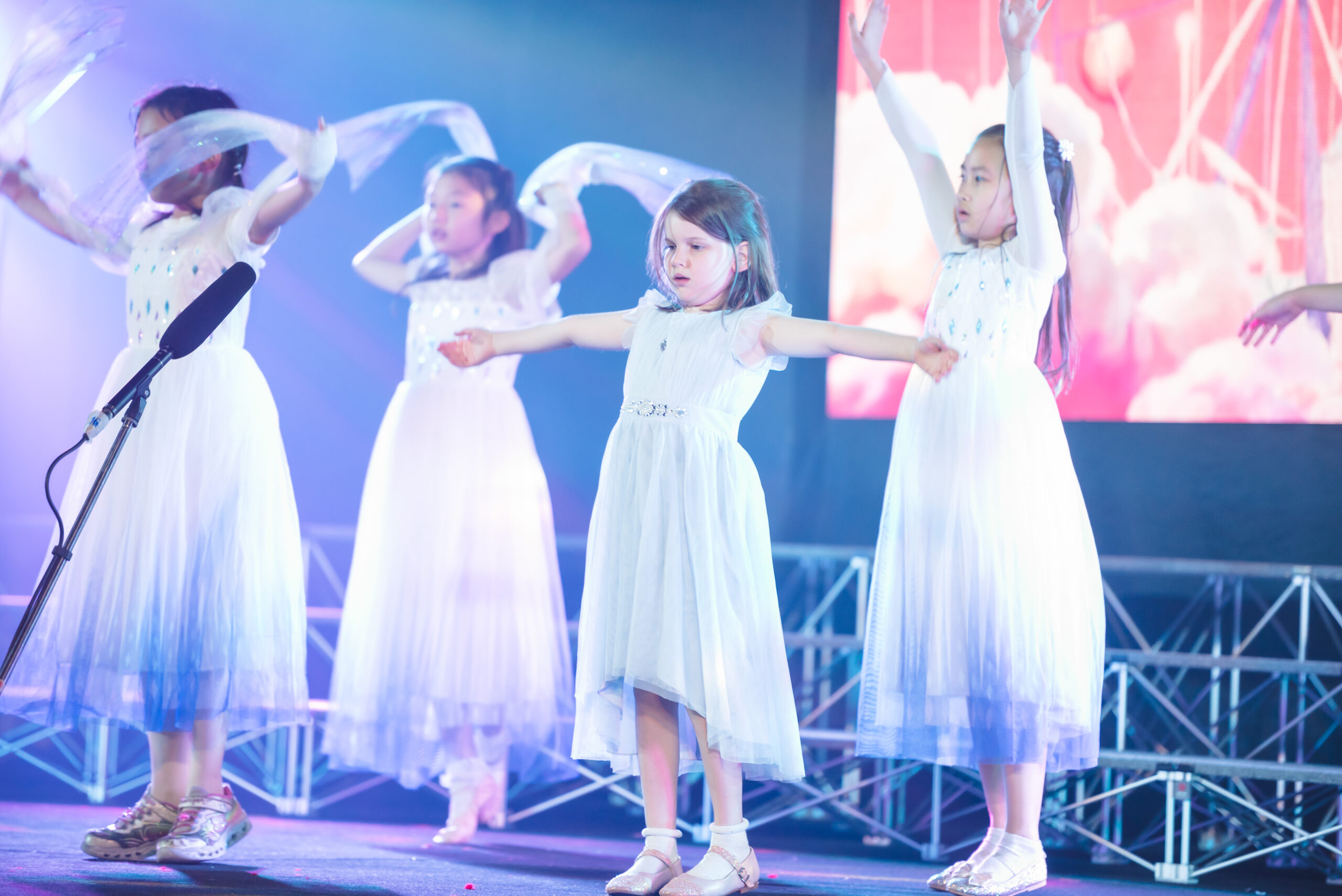 Girls dancing on stage for a school presentation