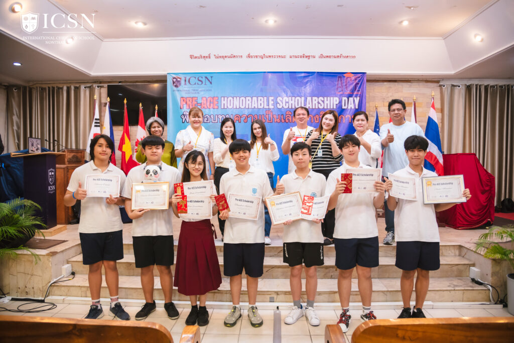 Students on stage holding certificate on an awarding ceremony