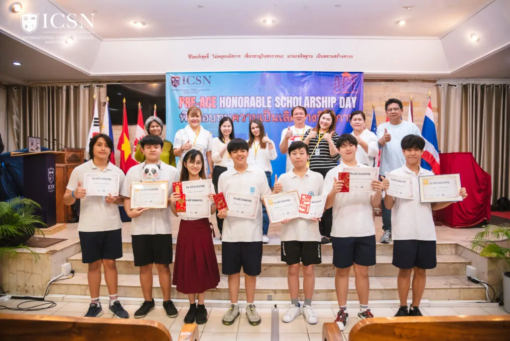 Students on stage holding certificate on an awarding ceremony